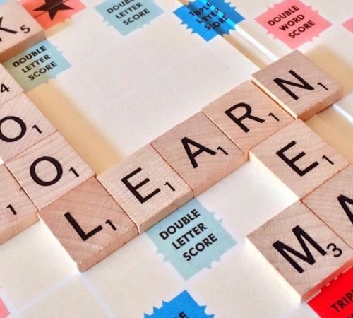 pexels photo 256417 256417 Close-up of Scrabble tiles forming words related to education and school.